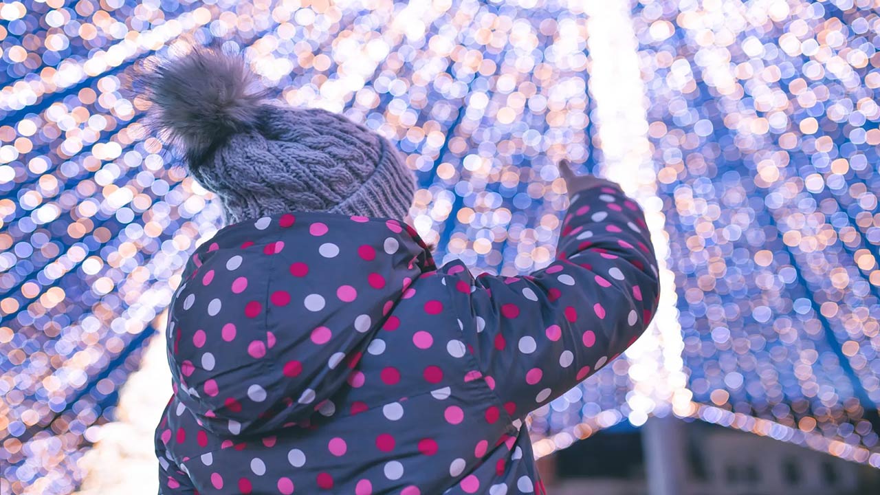 little girl having fun at the christmas market